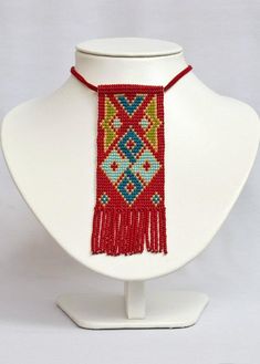 we proudly present our exquisite Armenian Rug Motifs Ethnic Statement Beaded Necklace. This unique and captivating necklace is not only a beautiful piece of jewelry but also a symbol of rich cultural heritage, making it an ideal Armenian gift or a meaningful addition to your jewelry collection. Key Features:     Ethnic Elegance: Our necklace features intricate Armenian rug motifs, inspired by the artistry of Persian rug designs. These motifs have been meticulously recreated in beadwork, adding a Armenian Rug, Armenian Jewelry, Armenian Culture, Persian Rug Designs, Bead Loom Designs, Rug Designs, Beading Jewelery, Boho Accessories, Beaded Collar