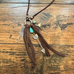 Handmade in Idaho by Weathered Soul exclusively for Bourbon Cowgirl. Limited Edition, high quality jewelry that is as unique and authentic as you! Due to their handcrafted nature, slight variations will occur. The feel and design of the product will remain true to the overall aesthetic. Features the following materials: Jewelers Pewter Copper Turquoise Deer Leather Made exclusively for us by Weathered Soul Artisan Sterling Silver Necklace For Festival, Artisan Handmade Silver Lariat Necklace, Handmade Artisan Silver Lariat Necklace, Artisan Long Necklace For Festivals, Sterling Silver Lariat Jewelry For Festivals, Adjustable Lariat Necklaces For Festivals, Lariat Necklaces With Adjustable Length For Festivals, Adjustable Length Lariat Necklaces For Festivals, Bohemian Lariat Necklace As Gift