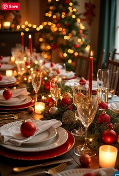 the table is set for christmas dinner with candles