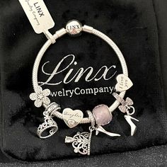 Linx Snake Chain Style Charm Bracelet In 925 Sterling Silver, With A Ball Clasp. The Bracelet Is 3mm In Width And Available In Multiple Lengths. This Bracelet Comes With 7 Linx 925 Sterling Silver Charms. All Items Are New And Come In A Luxury Velvet Jewelry Pouch. *Bracelet And Charms Are Superior Quality! Elegant Engraved Charm Bracelet, White Gold Charm Bracelet Gift Fine Jewelry, White Gold Charm Bracelet Fine Jewelry, White Gold Metal Charm Bracelet For Anniversary, Silver Fine Jewelry Bracelet As Gift For Her, Personalized Silver Charm Bracelet For Her, Personalized Silver Charm Bracelet As Gift For Her, White Gold Fine Jewelry Charm Bracelet Gift, Luxury White Gold Sterling Silver Charm Bracelet