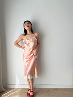 Vintage retro 1950s embroidered camisole slip dress in the softest pastel pink color material: pure silk satin Size: around S,M, Model wears size S, 36, 166cm, 54kg pit to pit: 43 cm waist:36cm Full length 112 cm condition: good antique condition Please keep in mind that this is almost 100 years old. It may have small marks and/or snags and sign of wear throughout. Please purchase willing to accept all signs of wear. --IMPORTANT NOTE--- PLEASE PROVIDE CONTACT NUMBER UPON CHECKOUT For shop update Feminine Silk Slip Dress For Daywear, Feminine Silk Slip Dress For Sleep, Delicate Sleeveless Satin Dress, Feminine Lace Slip Dress With Spaghetti Straps, Pink Silk Spaghetti Strap Camisole, Vintage Silk Slip Dress With Spaghetti Straps, Feminine Satin Nightgown For Summer, Feminine Satin Summer Nightgown, Feminine Silk Nightgown With Spaghetti Straps