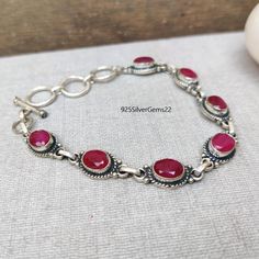 Welcome to our shop 925SilverGems22 Description:-  Style:- Bracelet Advantages of Ruby Bracelet:- As the birthstone of July, the red stone is so much more than a magnificent colored gemstone. The ruby has been believed to make its wearer more aware, more focused, and remain alert. There are also those who believe the stones can improve trouble with eyesight and blood circulation. Occasion:- Anniversary Gift, Birthday Gift, Wedding Gift, Gift Earring, Valentine's Gift, Engagement Gift, New Year Gift, Christmas Gift, Other Occasion, etc. Your order will be handmade and ready for shipment in 1-3 business days. Normally we ship through USPS it takes a maximum of 2 to 3 weeks if you need fast delivery you can select shipping in your cart. Why choose us over other sellers:- Fast Shipping  Best C Ruby Bracelets, Statement Bracelets, Ruby Bracelet, Jewelry Statement, Ruby Jewelry, Valentine's Gift, July Birthstone, Statement Bracelet, Red Stone