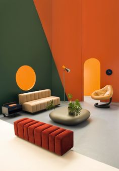 an orange and green living room with modern furniture