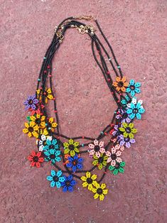 Seed Bead Flowers Handmade Necklace, It is an ideal necklace for summer with vibrant colors. Made of seed bead. Beaded Multicolor Flower Necklace For Beach, Colorful Bead Flower Necklace For Beach, Colorful Beads Flower Necklace For Beach, Flower-shaped Beaded Necklaces For The Beach, Colorful Beaded Flower Necklace For The Beach, Colorful Beaded Flower Necklace For Beach, Colorful Flower Necklace For Beach, Multicolor Bohemian Flower Necklace With Tiny Beads, Festival Flower Shaped Beaded Necklace With Tiny Beads