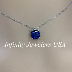 "This necklace is a web cut lab created blue sapphire, 18\"cable chain, 14k white gold #6390 September Birthstone -Approximate total carat weight: 3.30ctw diamond equivalent -Center Stone Size: 9x9mm approx. 3.30ct diamond equivalent -Center Stone Shape: web cut / octagon -Gem Type: lab created blue sapphire -Stone Clarity: VS2 -Stone Color: blue -Moh's Scale: 9 hardness -Metal Type and Purity: 14k white gold -Setting: 4 prong basket -Chain: 18\" delicate 14k gold chain / heavier option with lob Sapphire Jewelry With Brilliant Cut Round Stone, Sapphire Necklace With Diamond Cut Round Pendant, Sapphire Round Pendant Necklace With Diamond Cut, Lab-created Sapphire Round Necklace For Gift, Sterling Silver Sapphire Jewelry Brilliant Cut, Silver Necklace With Prong-set Lab-created Sapphire, Diamond Cut Lab-created Sapphire Necklace As Gift, Silver Necklace With Lab-created Sapphire In Prong Setting, Sapphire Sterling Silver Jewelry With Brilliant Cut