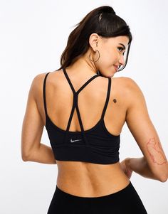 Sportswear by Nike Training Supportive stuff Layered design Scoop neck Strappy, racer back for unrestricted movement Nike logo print on back Pull-on style Fitness Aesthetic, Vs Bras, Nike Training, Layered Design, Workout Aesthetic, Racer Back, New Nike, Layers Design, Nike Logo