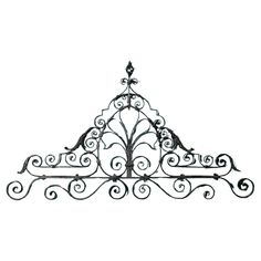 a wrought iron shelf with birds on it