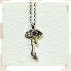 Sad but Rad necklace Gift Drop Necklace With Charms, Eye-shaped Amulet Necklace As Gift, Amulet Eye Necklace Gift, Silver Pendant Necklace With Diamond Eyes, Symbolic Eye-shaped Silver Jewelry, Spiritual Metal Evil Eye Necklace, Silver Evil Eye Symbolic Necklace, Silver Symbolic Evil Eye Necklace, Spiritual Evil Eye Metal Necklace