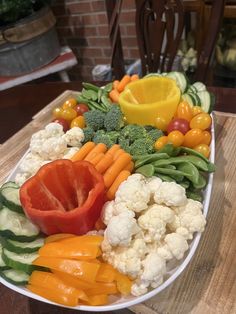 a platter filled with lots of different types of vegetables