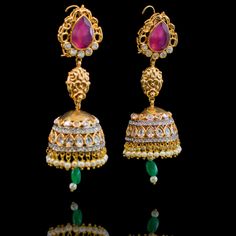 Our Saarika Look sets the mood for vintage glamour with Mughal undertones! A stunning mala necklace in colorful combination of ruby, emerald and CZ stones and beads. Approximate mala length is 15". The look includes a pair beautiful jhumkey earrings. Approximate earrings length is 3.5". Gold-plated on high-quality brass as base metal. In-stock & ready-to-ship. *Please Note: We use faux stones and beads in all of our jewelry. Fusion Style Festive Jhumkas With Stone Work, Festive Fusion Jhumkas With Stone Work, Fusion Style Kundan Necklace With Latkans, Fusion Kundan Necklace With Latkans, Fusion Style Kundan Jhumkas With Stone Work, Fusion Kundan Jhumkas With Stone Work, Fusion Style Chandbali Kundan Necklace With Latkans, Festive Fusion Kundan Necklace With Latkans, Traditional Ruby Kundan Necklace For Celebration