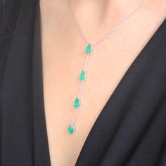 Dazzle with elegance with our 925 Sterling Silver Paraiba Gemstone Y Necklace, featuring a stunning emerald-like appearance that captivates and charms. Elevate your style with our exquisite Paraiba Gemstone Y Necklace, a mesmerizing blend of elegance and sophistication. This handcrafted masterpiece is created with precision and passion, featuring a choice between two stunning versions, each boasting the unparalleled beauty of Paraiba gemstones. Version 1 - Red Paraiba Elegance: Embrace the allur Formal Drop Emerald Gemstone Necklace, Elegant Silver Drop Emerald Necklace, Green Emerald Drop Necklace For Formal Occasions, Green Drop Emerald Necklace For Formal Occasions, Silver Drop Necklace With Emerald, Elegant Green Gemstones In Sterling Silver, Silver Emerald Drop Necklace, Silver Emerald Necklace With Stones, Green Sterling Silver Gemstones For Formal Occasions