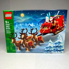 a lego christmas set with reindeers pulling a sleigh