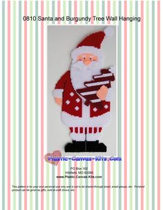 a santa clause holding a cake on top of a white board with pink and green stripes