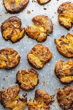 baked potatoes on a baking sheet ready to be cooked in the oven for dinner time