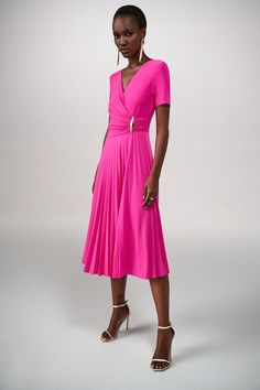 True refinement starts with this classy look from Joseph Ribkoff. Designed in a stretchy fabric that conforms to your figure, the style's surplice neckline is a graceful detail. A voluminous, pleated skirt gives the look a playful touch, making this the ideal outfit for days or evenings. 96% Polyester, -4% Spandex No pockets No zipper Cold water hand wash or hand wash cycle Do not bleach Hang to dry Do not tumble dry Low iron Do not dry clean Wash garment inside out Joseph Ribkoff Dresses, Animal Print Tote Bags, Midi Dress Style, Leopard Print Scarf, Fur Lined Boots, Surplice Neckline, Knit Wrap, Leggings Sale, Pleated Midi Dress