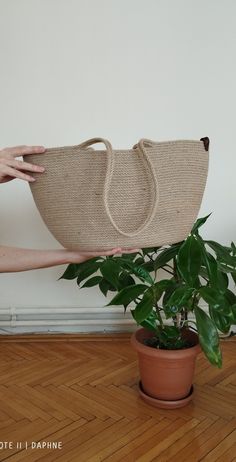 Meet the Jute Beach bag, the perfect carrying case for every beach adventure. This stylish and natural jute bag is ideal for stylish people who want to protect their belongings on beach trips. Made from 100% natural jute, this beach bag is both lightweight and tough enough to store your belongings safely. The bag has a tight-fitting drawstring, which means your belongings will stay safe while exploring the beach. Jute is naturally water resistant and protects your belongings from sand particles or any outdoor elements. The inside of this beach bag is spacious enough to hold all the supplies you might need to spend a day at the beach. Whether you're packing books, towels, sunscreen, snacks, or anything else, you can rest assured that Jute Back Beach has you covered. The bag also comes with Eco-friendly Sand Shoulder Bag For Daily Use, Eco-friendly Sand Crochet Bag For Everyday Use, Large Capacity Eco-friendly Jute Beach Bag, Eco-friendly Sand-colored Jute Straw Bag, Eco-friendly Large Capacity Jute Crochet Bag, Eco-friendly Large Canvas Bag In Natural Color, Eco-friendly Large Capacity Natural Canvas Bag, Natural Canvas Shoulder Bag For Daily Use, Large Capacity Jute Beach Bag For Everyday