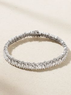 Those in the know will recognize this tennis bracelet as part of Suzanne Kalan's award-winning 'Fireworks' collection. Meticulously set with a total of 174 baguette and round-cut diamonds, it's handmade from 18-karat white gold and has a standard seven inch length. Don't just reserve yours for special occasions. Luxury Platinum Diamond Bracelet With Baguette Diamonds, Timeless Tennis Bracelet With Baguette Diamonds, Luxury Round Tennis Bracelet With Baguette Diamonds, Fine Jewelry Platinum Tennis Bracelet With Baguette Diamonds, Luxury White Gold Tennis Bracelet With Baguette Diamonds, Timeless Baguette Cut Jubilee Tennis Bracelet, Timeless Baguette Cut Tennis Bracelet, Platinum Tennis Bracelet With Baguette Diamonds, Formal White Gold Baguette Diamond Bracelet