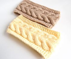 three crocheted headbands sitting next to each other on a white surface