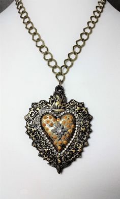 "This item is handmade and one-of-a kind. A truly unique conversation piece! Made of polymer clay, Gilder's paste, rhinestone chain and embellishment, dimensional paint, and sealed with lacquer. Antique gold-plated chain and lobster clasp. Chain length is approx. 20\".  Please note my shop policy is no returns or exchanges. All sales are final.  CARE TIPS FOR BUYER: I recommend that this piece should be treated like any other fine piece of jewelry. Although polymer clay is a lightweight and dura Red Pendant Necklace, Abstract Pendant, Handmade Pendant Necklace, Red Pendants, Rhinestone Chain, Polymer Clay Pendant, Sacred Heart, Handmade Polymer Clay, Handmade Pendants