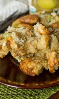 a close up of a plate of food with broccoli and stuffing on it