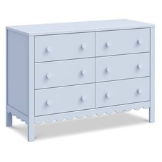 a white dresser with four drawers and two knobs on the top, in front of a white background