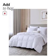 a white comforter on a bed in a bedroom