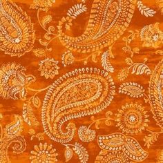 an orange and gold paisley print fabric