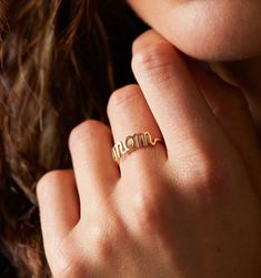 This mothers ring is the cutest way for Mom to feel the love all day, everyday. For all the incredible moms out there, this piece is made to honor you. Womens gold ring, Jewelry gold rings, Trendy gold ring, womens rings, Unique womens rings, Casual womens ring, womens jewelry rings, Womens jewelry trends 2020, Womens jewelry fashion, Jewelry accessories! #goldrings #rings #womensrings #jewelry #rellery Womens Rings Unique, Rings Casual, Jewelry Gold Rings, Gold Ring Jewelry, Rings Trendy, Mothers Ring, Womens Jewelry Trends, Mom Ring, All Day Everyday