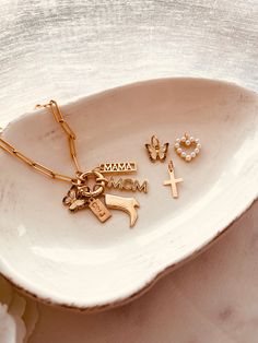 BUILD YOUR COLLECTION - Mix and match your favorite pendant charms to create a story bracelet.When you add this piece to your cart, the form will prompt you to leave the following details.Examples:Initial Tag: C ( heart ) JPearl drop and Mom charm.Charm options:MAMA charm - 18k gold filled. Initial Tag - 14k gold filled, 6mmx12mm - max 3-4 characters (see the pictures above), so please keep that in mind when ordering. :)Pearl Heart charm (out of stock ) Pearl Drop - 14k gold filledMOM - 18k gold Gold Charm Bracelet With Star Charm As A Gift, 14k Gold-tone Charm Bracelet As Gift, Trendy Tarnish-resistant Yellow Gold Charm Bracelet, Trendy Gold-tone Gold Plated Charm Bracelet, Gold Bracelet With Starfish Charm, Adjustable, Sewing Tape Measure, Flower Accessories, Personalized Bracelets, Pearl Drop