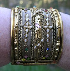 "Wonderfull AMAZING Chunky gold tone stones Bracelet unsigned. 1970's Measures inside 2 1/4 x 2 5/8\" x 2 2/8\" wide. missing a few tiny pearls other wise it's in very good vintage condition" Vintage Wide Band Jewelry With Intricate Design, Unique Gold Beaded Cuff Bracelet, Vintage Jeweled Gold Bracelets, Antique Jeweled Gold Bracelets, Vintage Gold Jeweled Bracelets, Antique Gold Cuff Bracelet With 17 Jewels, Ornate Gold Bracelets With Jewels, Gold Victorian Cuff Bracelet With Intricate Design, Ornate Gold Jeweled Bracelets