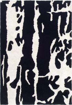 a black and white rug with an abstract design on the bottom, in front of a white background