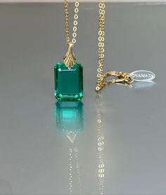 Gorgeous sparkly Colombian emerald pendant necklace. The rectangle shape facet pendant is eye-clean and has gorgeous Caribean ocean green color that brings lots of depth to the stone and reflects lights beautifully. The ultra-fine pendant has great clarity and reflects lights beautifully and is attached to a gold-filled bail and suspended on a 14k gold fill chain. The necklace is elegant and has a lux look. * AAA+ Flawless Faceted Colombian emerald (20 cts) * Pendant size(with the bail): 27x18 m Rectangular Gemstone Necklace For Formal Occasions, Formal Rectangular Gemstone Necklace, Formal Necklace With Rectangular Gemstone Pendant, Formal Gemstone Necklace With Rectangular Pendant, Faceted Emerald Cut Necklace For Gifts, Emerald Cut Faceted Necklace For Gift, Yellow Gold Emerald Jewelry With Rectangular Stone, Formal Emerald Necklace With Rectangular Pendant, Elegant Rectangular Emerald Necklace For Formal Occasions