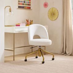 a white chair sitting in front of a desk