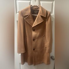 Tan Wool Coat; Chocolate Colored Liner. Deep Pockets. Button Up. Very Gently Used. Size Is Unavailable. Measurements Below (Approximations): Shoulder To Shoulder: 18” Shoulder To Hem: 36” Armpit To Armpit: 21.5” Classic Wool Button-up Outerwear, Classic Button-up Outerwear For Business Casual, Classic Button-up Business Casual Outerwear, Classic Fitted Beige Outerwear, Formal Winter Outerwear With Snap Buttons, Classic Pea Coat With Snap Buttons And Lapel Collar, Classic Button-up Pea Coat With Double Button Closure, Formal Fall Outerwear With Snap Buttons, Classic Collared Wool Outerwear