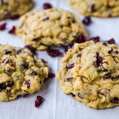 cranberry oatmeal cookies sitting on top of a white paper towel