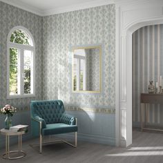 a blue chair sitting in front of a window next to a table with a vase on it