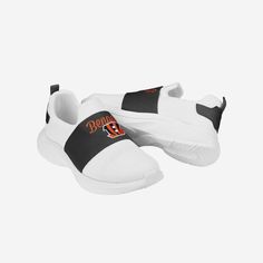 You are the heart and soul of your fanbase. But with these Cincinnati Bengals Women's Script Wordmark White Slip On Sneakers, you'll also be the heart and "sole." Features All-over white design so you can rep the team in style Team-colored strap with team logo display and script team name display, in case there were any doubts where your allegiances lie Team-colored bootstrap on heel for a little extra team spirit Mesh construction for epic comfort and versatility Slip-on structure for an easy w Cincinnati Bengals Shoes, Cincinnati Bengals Sweatshirt, White Slip On Sneakers, White Slip, Logo Display, On Sneakers, Heart And Soul, Team Name, Philadelphia Phillies