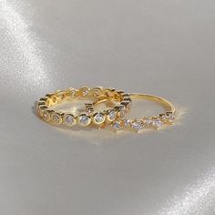 Make a sparkly statement with our Bezel eternity ring set with round grade 5A CZ's. It has the wow factor to be worn alone or stacked with our other rings. - Made in gold vermeil: a thick 18k gold layer on sterling silver.- Band thickness: 1.8 mm.- Shower safe, tarnish resistant & hypoallergenic Ring Size Chart. If you are in between sizes, we recommend sizing up. Ring Size Chart, Eternity Ring Set, Half Eternity Band, Half Eternity Ring, Wow Factor, Sterling Silver Bands, Gold Filled Jewelry, Wow Products, Eternity Bands