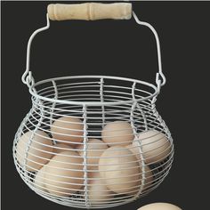 a metal basket filled with eggs next to an egg holder