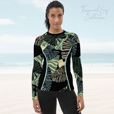 Don't be afraid to be your most active self in this smooth and versatile long-sleeve rash guard! It protects you from the sun, wind, and other elements while doing sports, and the slim fit, flat ergonomic seams, and the longer body gives extra comfort. * 82% polyester, 18% spandex * 6.78 oz/yd² (230 g/m²) (weight may vary by 5%) * Very soft four-way stretch fabric that stretches and recovers on the cross and lengthwise grains * Fitted design * UPF 50+ * Comfortable longer body and sleeves  * Flatseam and coverstitch This product is made especially for you as soon as you place an order, which is why it takes us a bit longer to deliver it to you. Making products on demand instead of in bulk helps reduce overproduction, so thank you for making thoughtful purchasing decisions! Casual Black Rash Guard For Surfing, Black Casual Rash Guard For Surfing, Long Sleeve Swimwear With Upf 50+ For Outdoor, Sporty Fitted Rash Guard For Outdoor, Green Long Sleeve Swimwear For Sports, Sporty Long Sleeve Swimwear For Outdoor, Green Long Sleeve Sports Swimwear, Sporty Long Sleeve Outdoor Swimwear, Casual Long Sleeve Tops For Water Sports