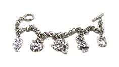 "Owl Bracelet Show off your love of Owls with this fun, unique piece of jewelry! Delicate bracelet, lovely to wear and wonderful to give. The charms and the bracelet are made from a zinc alloy metal which is both lead and nickel free. This is an awesome collection of charms for the owl lover in your life! PLEASE NOTE: From time to time we may need to substitute one of the charms for another, all keeping with the theme of the collection. Charm is zinc alloy, lead and nickel free. Each charms meas Adjustable Novelty Charm Bracelet, Adjustable Novelty Charms Bracelets, Personalized Novelty Charm Bracelet, Nickel Free Novelty Bracelet Jewelry, Vintage Adjustable Bracelets With Dangling Charms, Vintage Adjustable Bracelet With Dangling Charms, Novelty Charms Bracelet Jewelry, Novelty Jewelry Charms Bracelet, Novelty Bracelet Jewelry As Gift