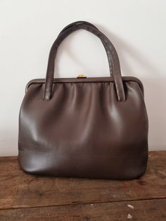 Description: Large Faux Leather MacLaren Handbag. Made in England. Measurements: WIDTH: 37cm,  HEIGHT: 27cm Classic Faux Leather Shoulder Bag With Top Carry Handle, Classic Faux Leather Tote Satchel, Classic Top Handle Faux Leather Satchel, Classic Faux Leather Satchel, Classic Handheld Faux Leather Bag, Classic Handheld Soft Leather Bag, Vintage Office Bags For Fall, Formal Handheld Faux Leather Bags, Formal Faux Leather Bags For Fall