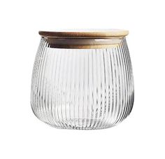 a glass jar with a wooden lid