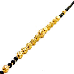 Weighing 4.3 grams, this 22k gold bracelet showcases a graceful yet jazzy design with black bead accents set against a radiant yellow gold finish. The 7.2-inch length, coupled with adjustable 0.6-inch links, ensures a perfect fit for any wrist. Secured by a hook lock, this bracelet offers a beautiful blend of traditional charm and modern flair, making it a versatile piece for both everyday wear and special occasions. PRODUCT DETAILS Gold Purity(karat): 22k Item Weight(grams): 4.3 Item Finish: Ye Black Bead Bracelet, 22k Gold Bracelet, Bridal Jewelry Necklace, Precious Stones Rings, Diamond Pendant Sets, Black Beaded Bracelets, Modern Bracelets, Fancy Necklace, Fancy Rings