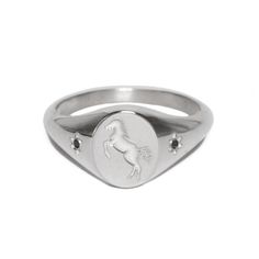 A rearing horse, deeply engraved in silver and saddled between two black onyx flowers. The ring's face measures approximately 8mm x 10mm. Please note, this product is made to order and has a lead time of 2-6 weeks.  Designed in collaboration with tattooer Tea Leigh. Engraved Silver Ring, Engraved Signet Ring, Rearing Horse, The Ring Face, Silver Engraving, Engagement Ring Wedding Band, Signet Ring, Lead Time, Black Onyx