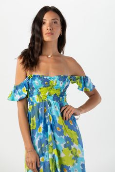 Born in the Borough that embodies the rhythm and soul of New York city, the Brooklyn Dress’ edge and grace has become a Tiare Hawaii staple. Perfect for beach getaways to nights out on the town, we love its effortless versatility and elegance. You’ll adore flowing with each step and accessorizing to your mood. Details: 100% Rayon Hand Wash & Lay flat to dry Features: Off the shoulder ruffle sleeve, Smocked sweetheart bodice, Elasticized neckline and waist, High-low ruffled hem Measures: Approxim Blue Beachwear Dress For Resort Season, Blue Fitted Beach Dress, Fitted Blue Beach Dress, Spring Beachy Maxi Dress For Poolside, Breezy Blue Beach Dress For Day Out, Fitted Blue Beach Dress For Vacation, Off-shoulder Beachwear Maxi Dress For Vacation, Blue Casual Dress For Resort Season, Casual Blue Dress For Resort Season