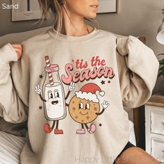 "Retro Tis The Season Sweatshirt, Cookies and Milk Sweatshirt, Retro Christmas Sweatshirt,  Hippie Apparel, Hippie Christmas, Holiday Apparel, Holiday Apparel for Women, Mom Christmas Sweatshirt, Bestfriend Christmas Gift, Funny Christmas Sweatshirt These sweatshirts are so soft and comfortable! They are perfect to wear this Holiday season! For an oversized look, order a size or two up from your normal size. Materials: 50% cotton, 50% polyester Medium-heavy fabric (8.0 oz/yd² (271.25 g/m Loose fit Sewn-in label Runs true to size Sizing: These are unisex sweatshirts so they fit a bit looser than women's sweatshirts. Please refer to the size chart image in the listing. I recommend taking one of your favorite sweatshirts and measuring it while it's laying flat. Our size chart measurements are Cute Holiday Crew Neck Sweatshirt, Cute Crew Neck Sweatshirt For Holiday, Best Friend Christmas Gifts, Santa Sweater, Colorful Sweatshirt, Winter Pullover, Sweater Cute, Christmas 2022, Christmas Mom