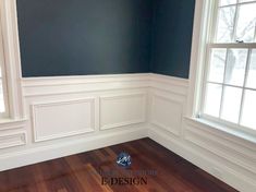 empty room with blue walls and wood flooring in residential home, new construction or remodeling