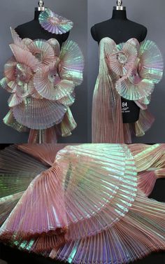 the dress is made out of pink iridescents and has an intricate flower on it