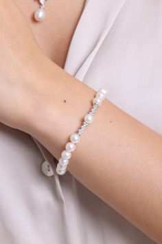 MATERIAL SPECIFICATIONS Metal : 14K Gold Gemstone: Pearl and Zircon Pearl Color: White Pearl Quality: AA Pearl Grain Size: 7 mm  Pearl Grain Shape: Round Bracelet Lengt: 18-19-20-21-23 cm Stock Code: Z098467 THE WEIGHT OF OUR PRODUCTS MAY VARY + - 5% GR The products will be securely shipped in special gift boxes, free of charge. Our handmade jewelry is crafted by our experienced team of jewelry makers with an eye for detail and perfection.  FOR OUR OTHER PRODUCTS PLEASE CHECK OUT: https://www.et Elegant Bracelets With Sparkling Stones For Anniversary, Elegant Bracelet With Sparkling Stones For Anniversary, Elegant Pearl Bracelet With Diamond Accents, Elegant Diamond Bracelet With Sparkling Stones For Anniversary, White Sparkling Stones Tennis Bracelet For Wedding, Classic Diamond Beaded Bracelets For Formal Occasions, Dainty Diamond White Bracelets For Formal Occasions, Dainty Diamond Bracelet With Sparkling Stones For Formal Occasions, Elegant Crystal Bracelet With Diamond Accents